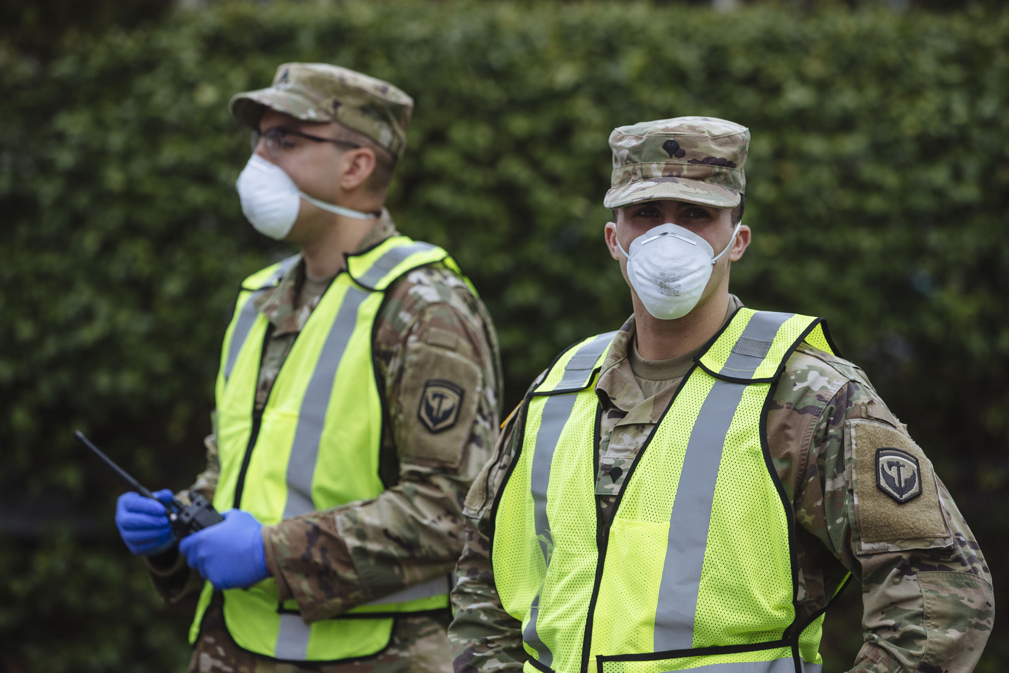 Members of the New Jersey Army National Guard guard a road block in front of a drive-through coronavirus testing facility at Bergen Community College in Paraumus, New Jersey, on March 20.