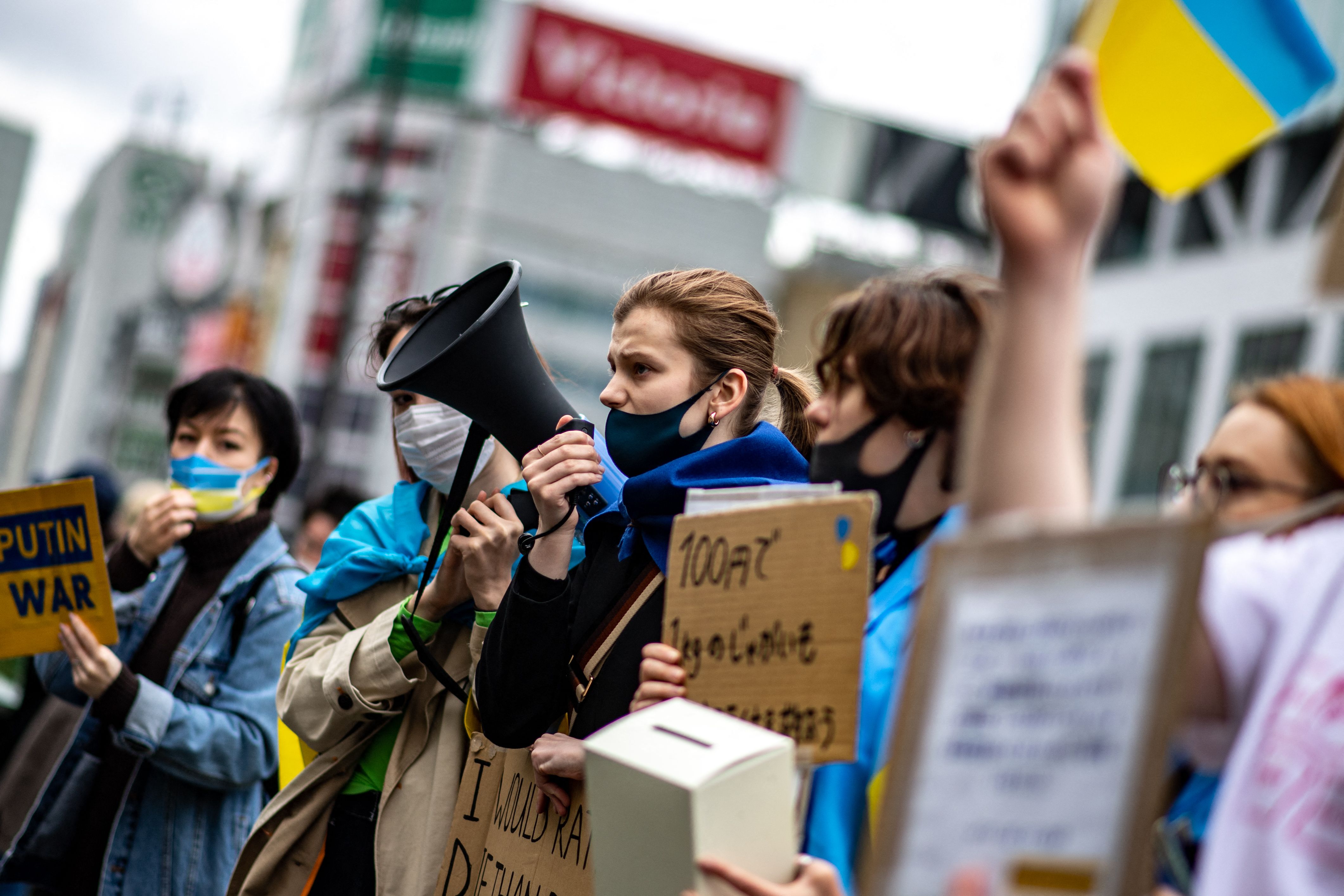 People take part in a fundraising demonstration to support Ukraine in Tokyo's Shinjuku district on March 26.