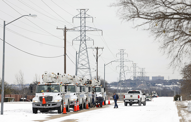 Pike Electric service trucks line up after a snow storm on February 16, in Fort Worth, Texas. 