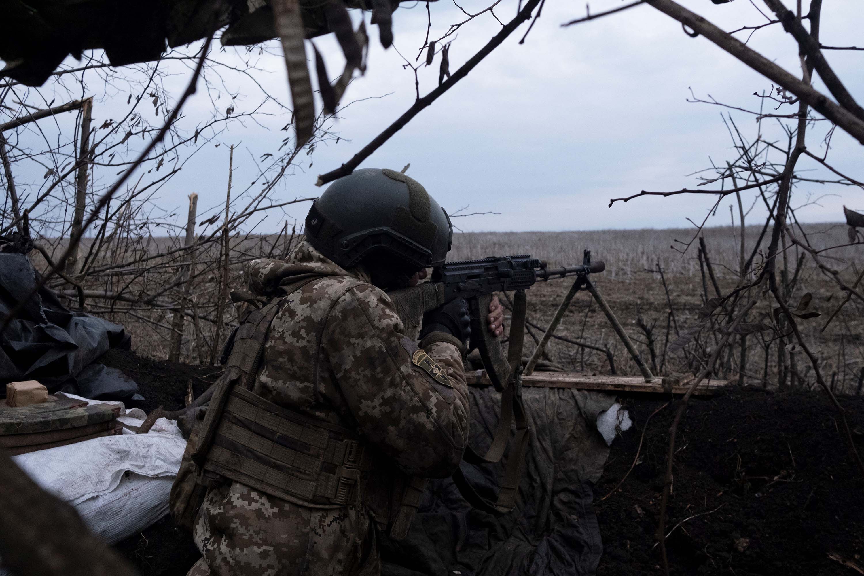 A soldier of the Ukrainian Volunteer Army fires at Russian front line positions near Bakhmut, on March 11. 