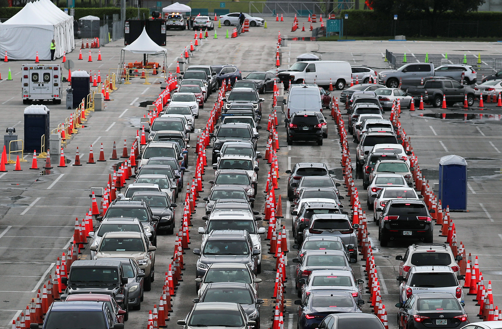 Cars are seen as the drivers wait to be tested for Covid-19 at the test site located in the Hard Rock Stadium parking lot on July 6, in Miami Gardens, Florida. 