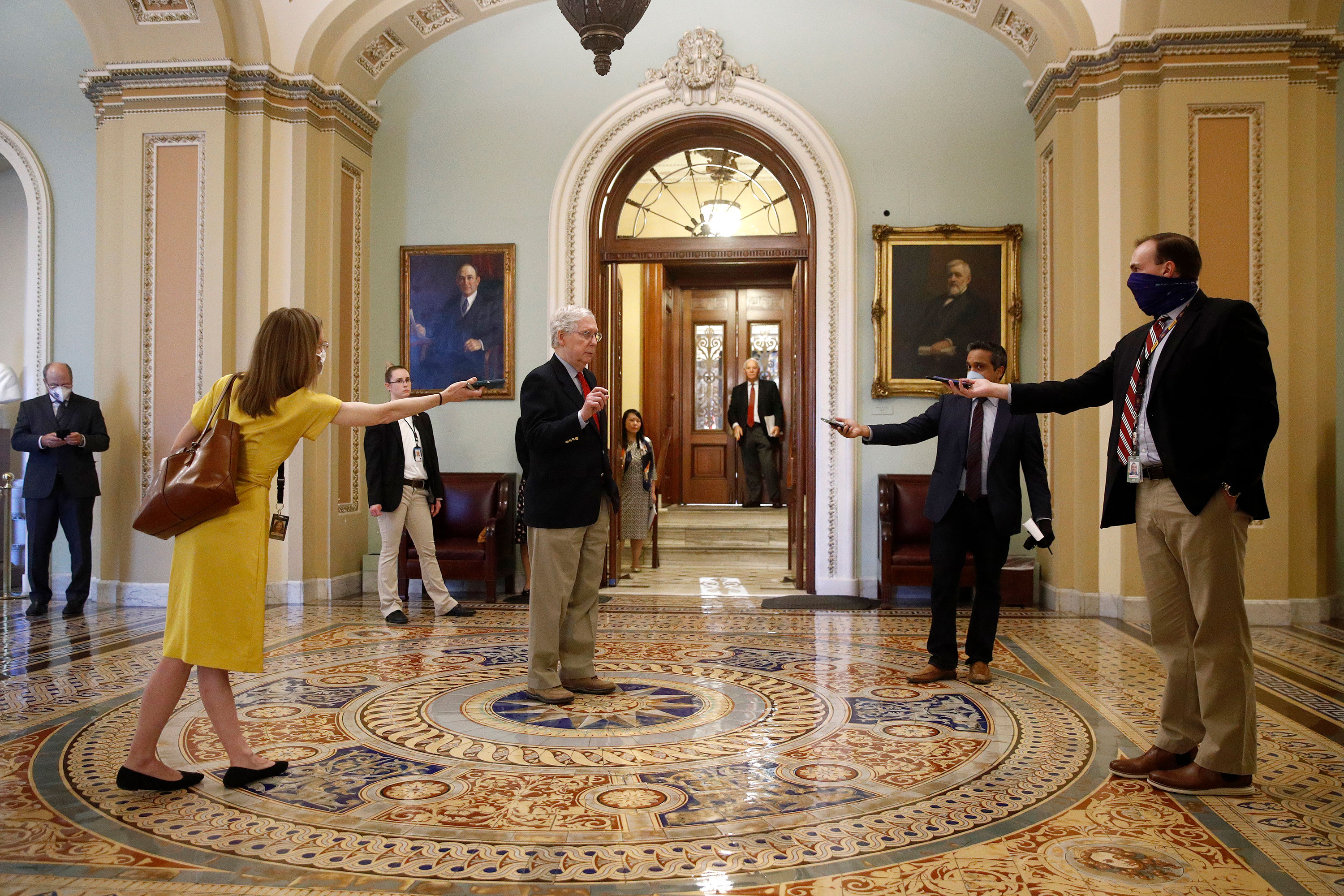 Senate Majority Leader Mitch McConnell speaks with reporters outside the Senate chamber on Capitol Hill on April 9.