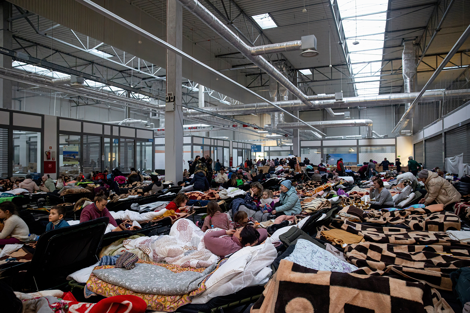 A temporary reception area has been set up at a warehouse at Korczowa, Poland, on March 7, to cope with hundreds of thousands of Ukrainian refugees fleeing through the Korczowa-Krakowiec border.