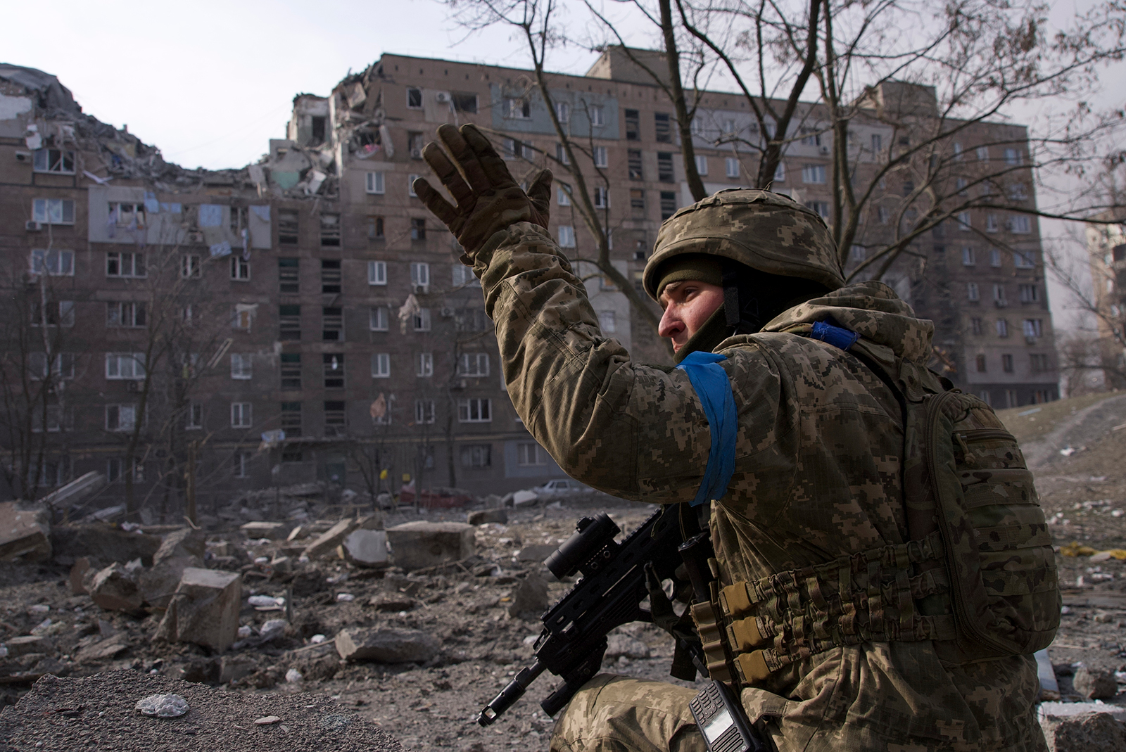 A Ukrainian serviceman guards his position in Mariupol, Ukraine, on Saturday, March 12.