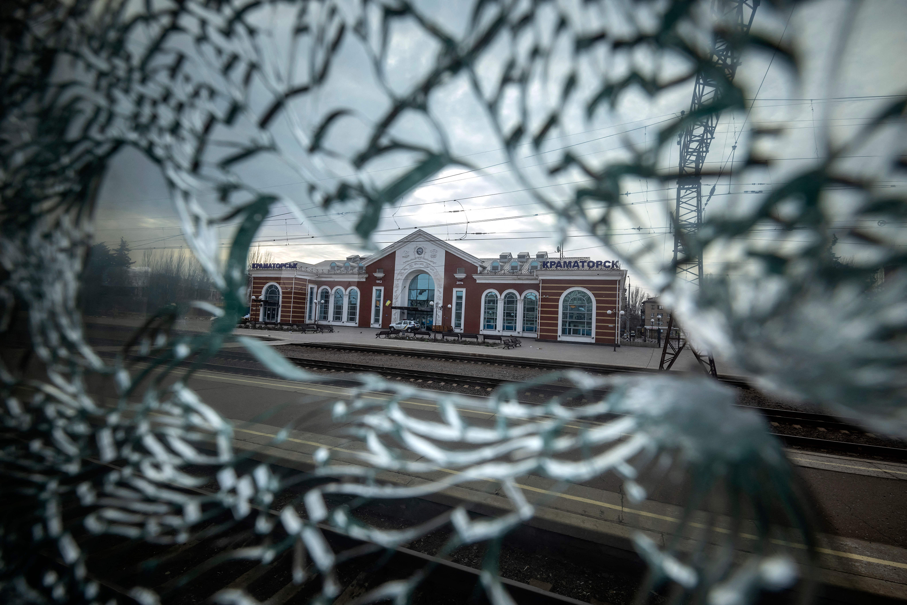The Kramatorsk train station is seen from the broken window of a train car on April 8.