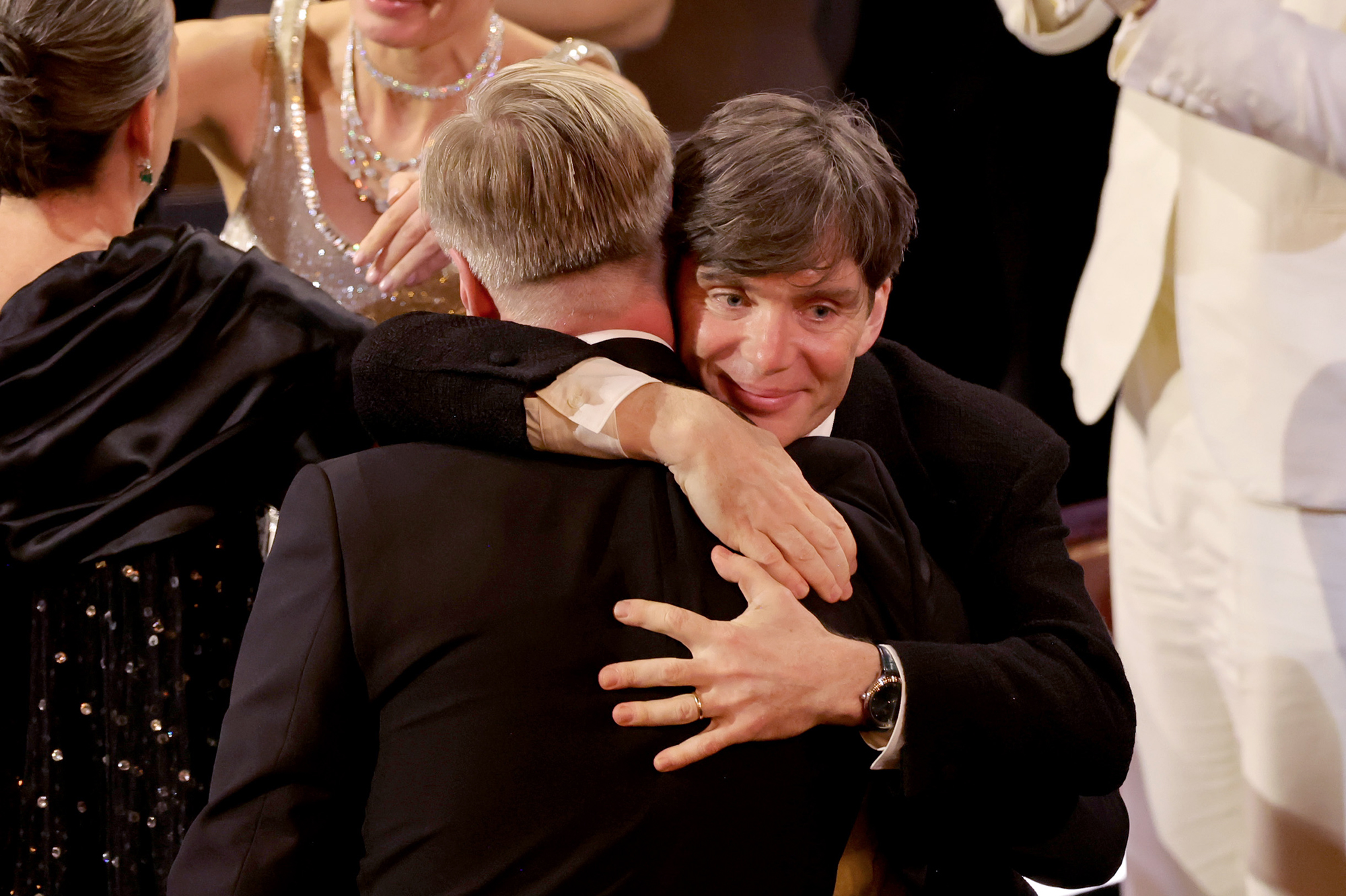 Christopher Nolan and Cillian Murphy embrace after winning the best picture award. 