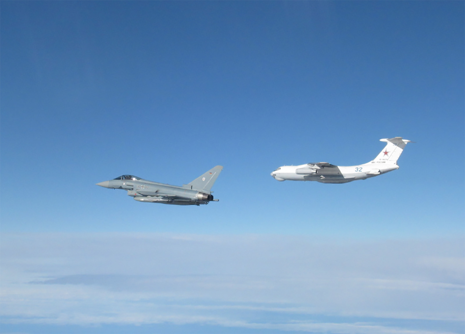 RAF and German Air Force Typhoons intercept a Russian aircraft in their first joint NATO air policing scramble in the handout image dated March 15.