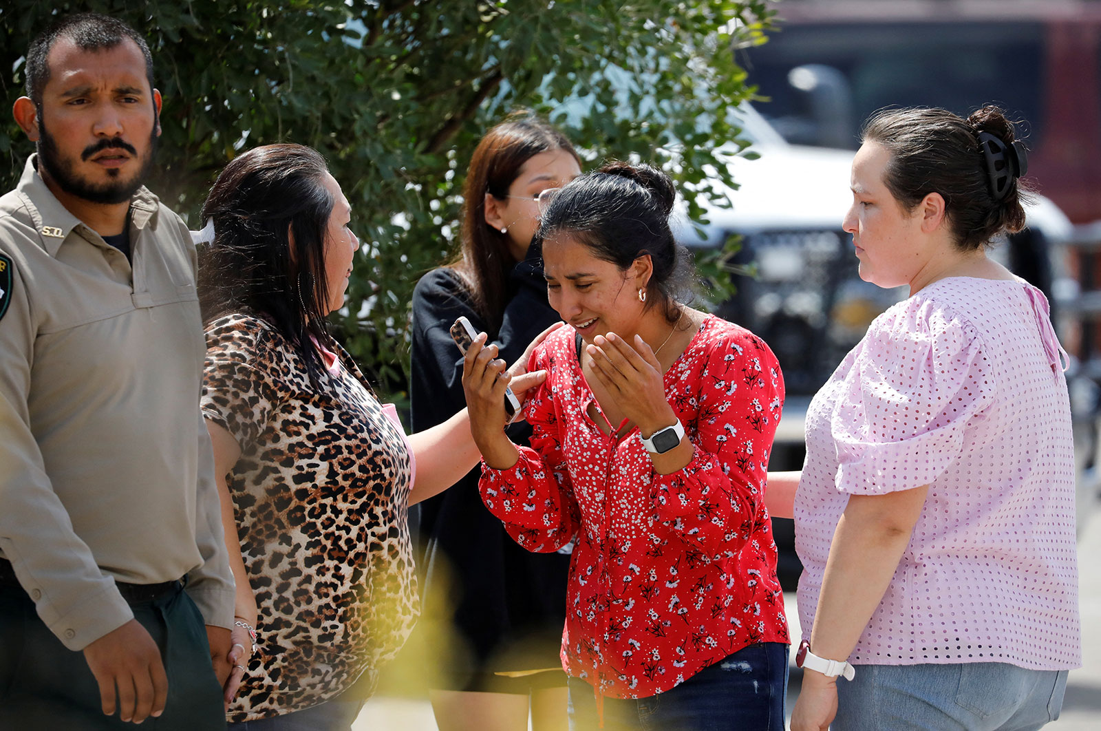 A woman reacts outside the SSGT Willie de Leon Civic Center, where students had been transported from Robb Elementary School after a shooting, in Uvalde, Texas, on May 24.