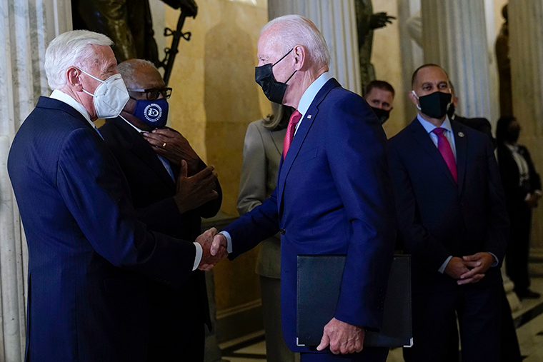 President Joe Biden shakes hands with Rep. Steny Hoyer as he arrives on Capitol Hill.