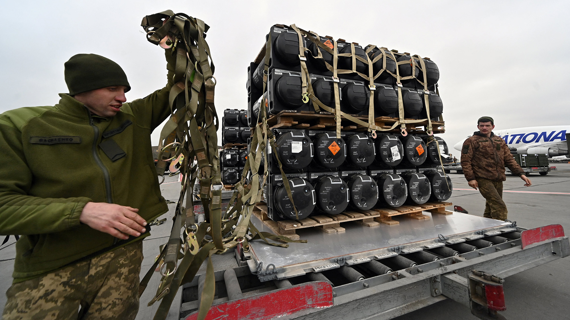 Ukrainian servicemen unload a plane with the FGM-148 Javelin, American man-portable anti-tank missile provided by the US to Ukraine on February 11.