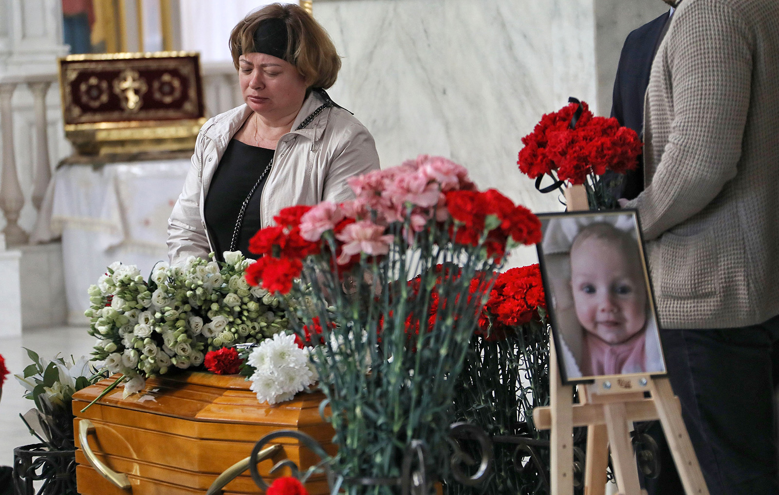 A funeral service for Valeriia Hlodan, her 3-month-old girl, Kira, and her mother, Liudmyla Yavkina, in Odesa, Ukraine, on April 27, following their deaths in a Russian missile strike.