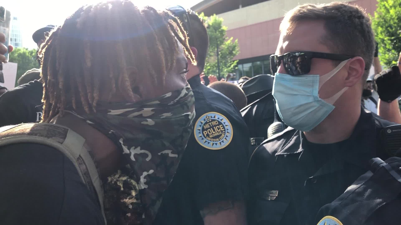 A Nashville protester face-to-face with a police officer on May 30, 2020.