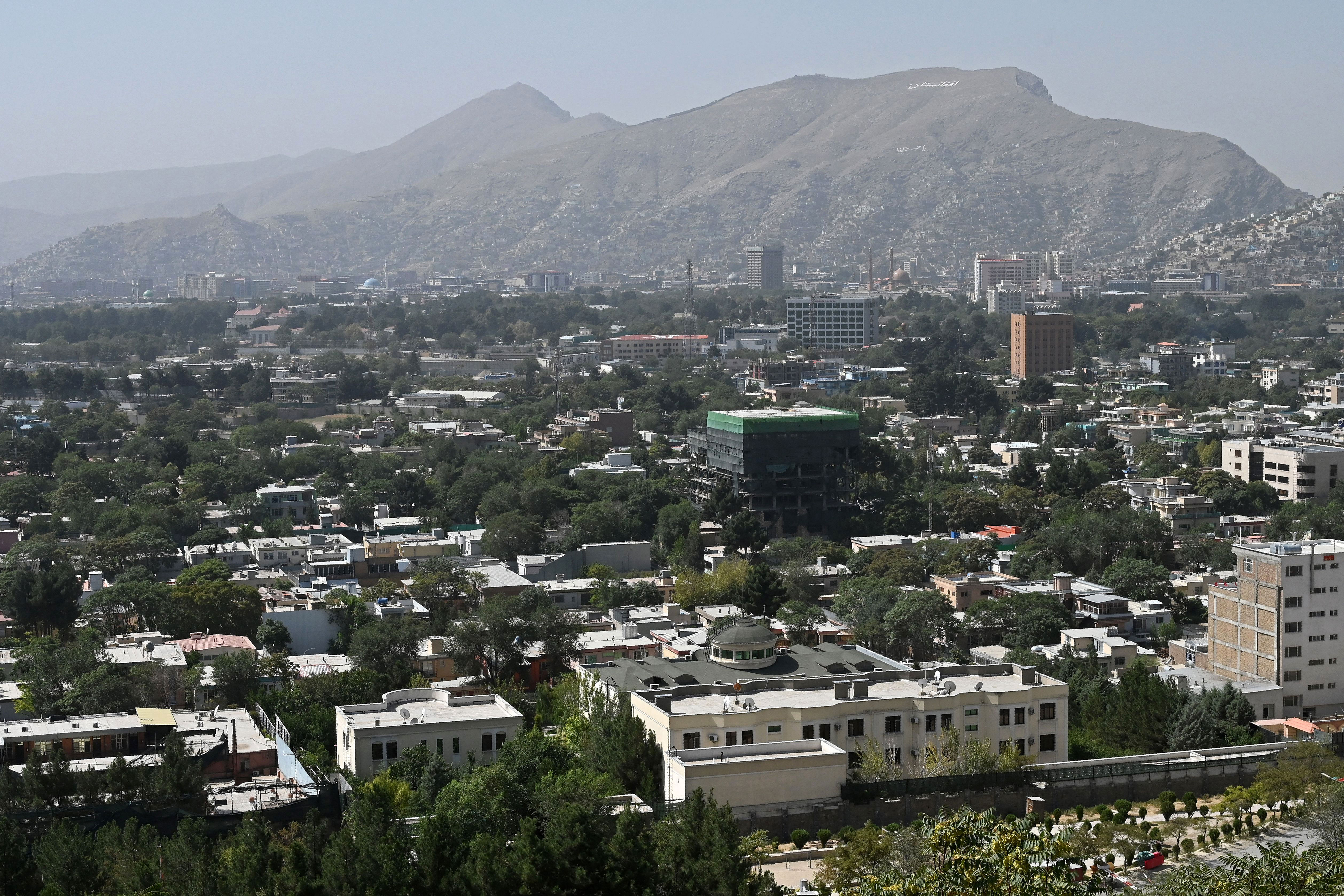 This picture taken from a hillside shows a view of Kabul, Afghanistan, on August 15, 2021.