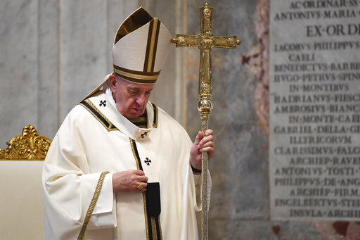 Pope Francis celebrates Easter Sunday Mass inside an empty St. Peter's Basilica, at the Vatican, Sunday, April 12.