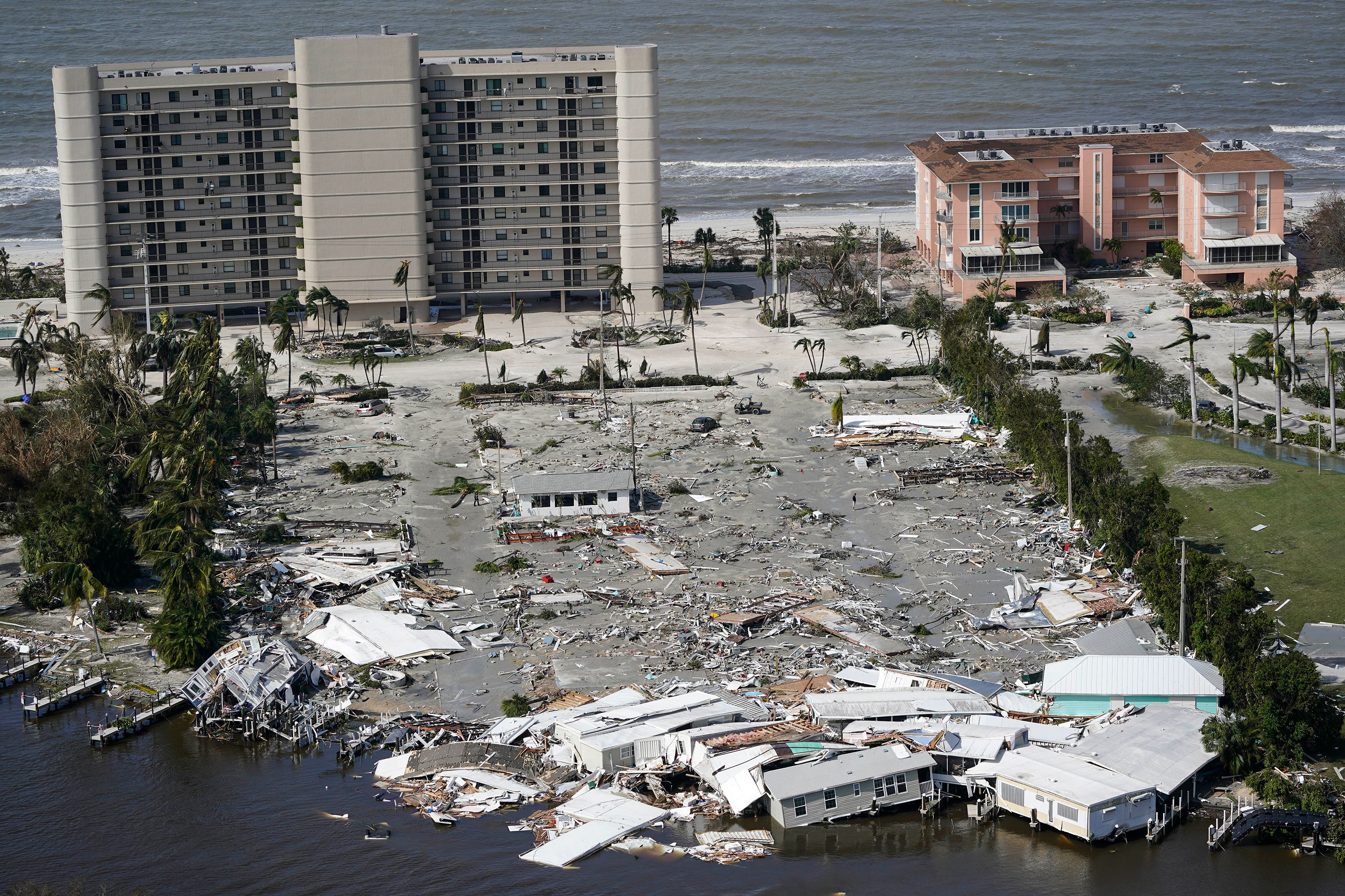 Damaged homes and debris are seen in Fort Myers, Florida, on Thursday.