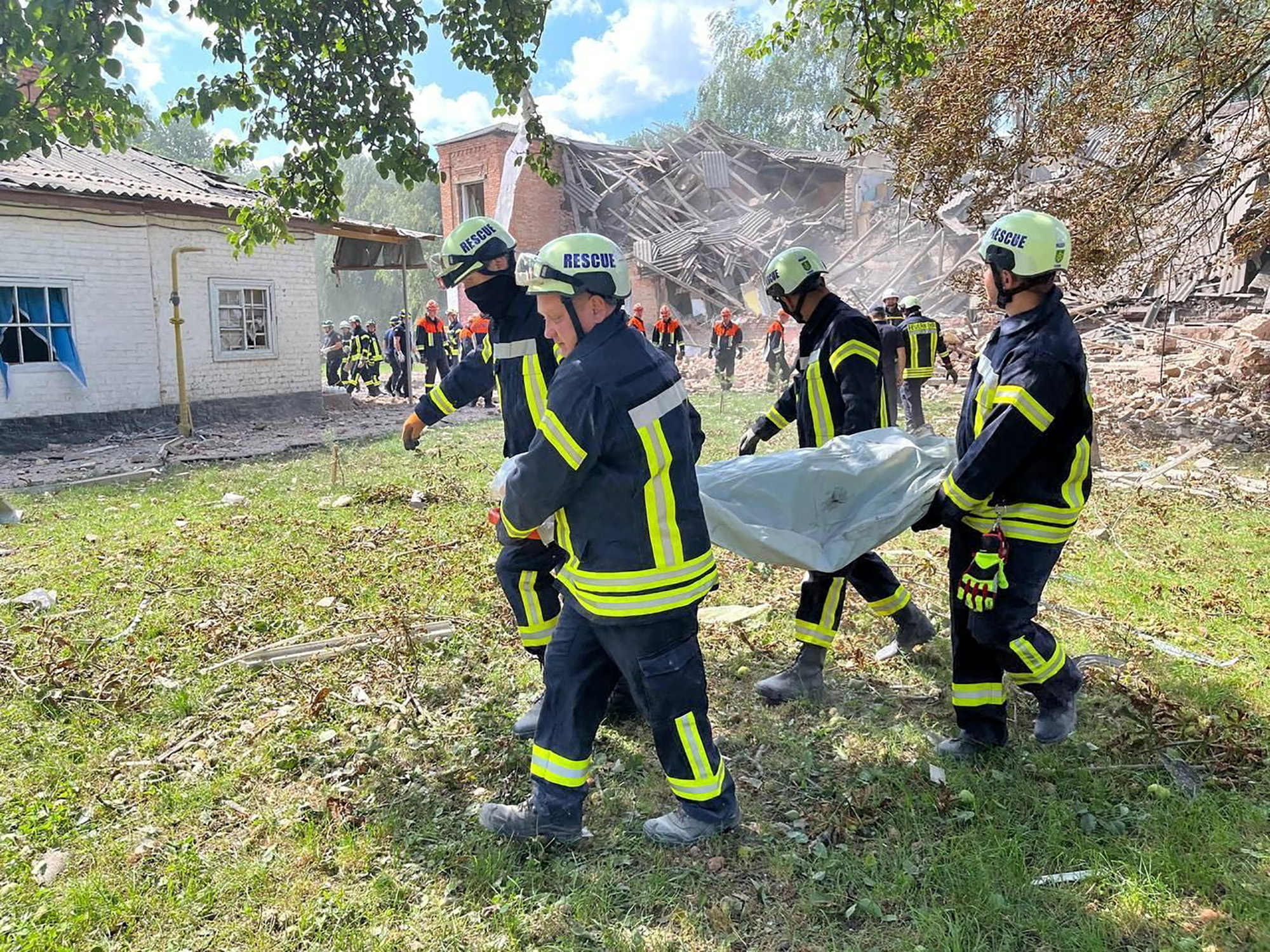 Rescuers work at the site of a Russian drone strike in Romny in Sumy region, Ukraine, on August 23.