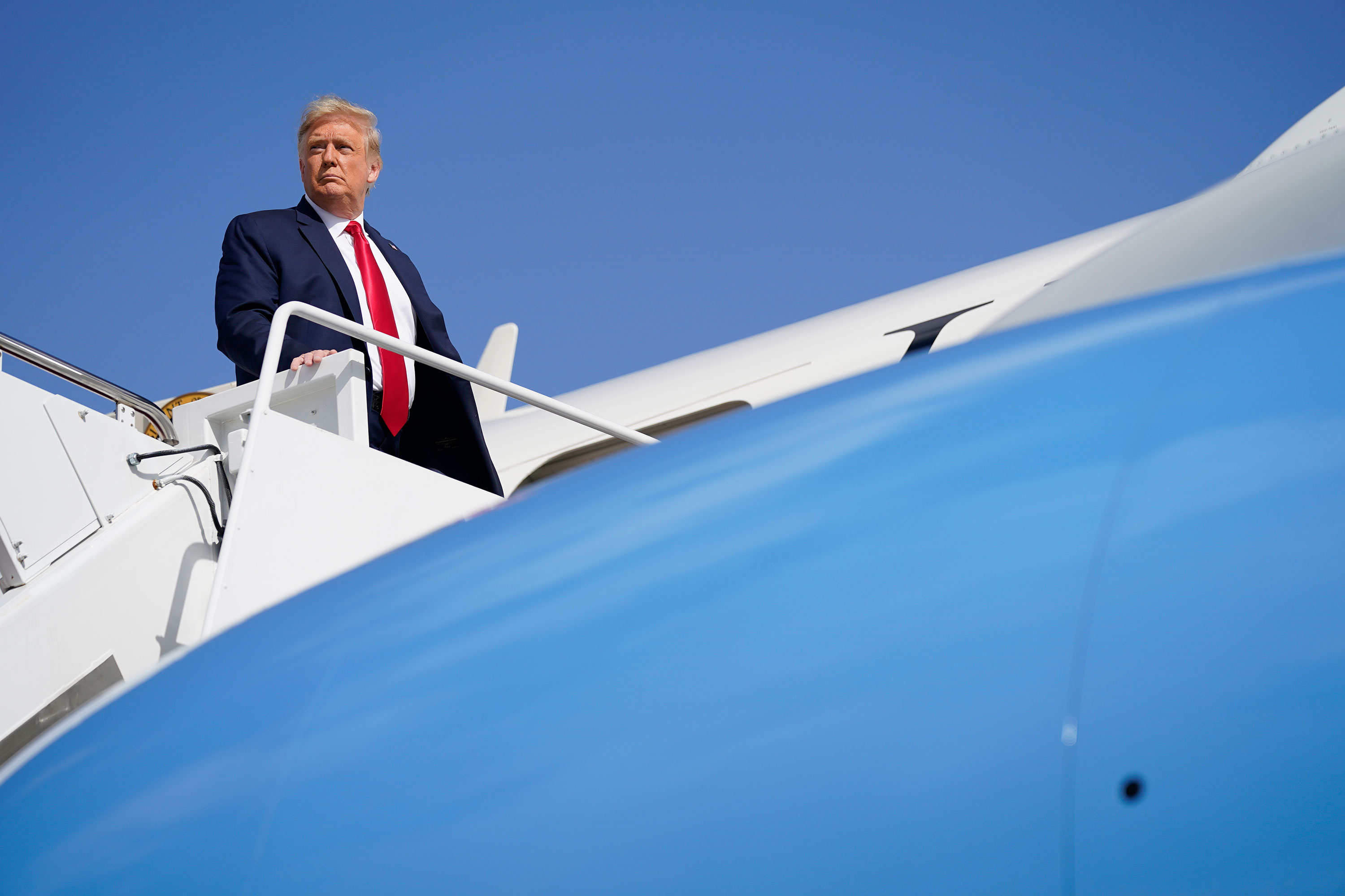 President Donald Trump boards Air Force One at Andrews Air Force Base to travel to campaign rallies in Florida on October 23. 