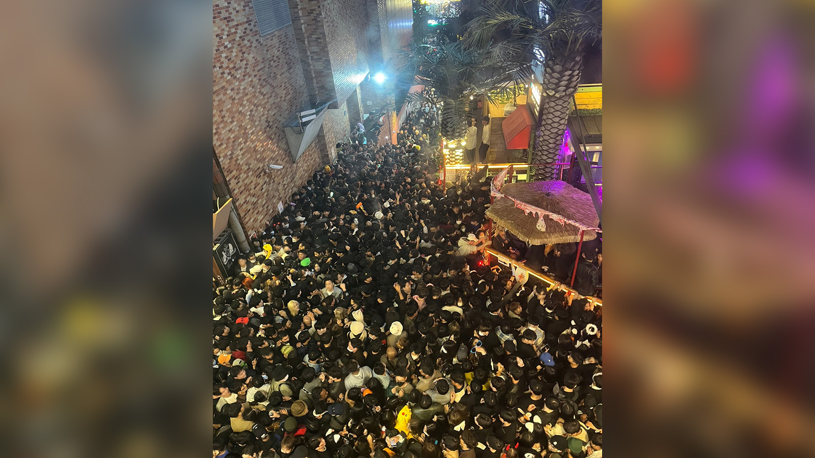 A street in Itaewon district is pictured full of people in Seoul on Saturday night.