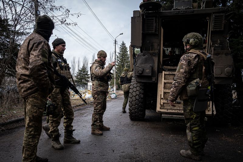 Ukrainian servicemen load an armored car before being deployed to the frontline of Bakhmut, in Chasiv Yar, Ukraine, on March 9.