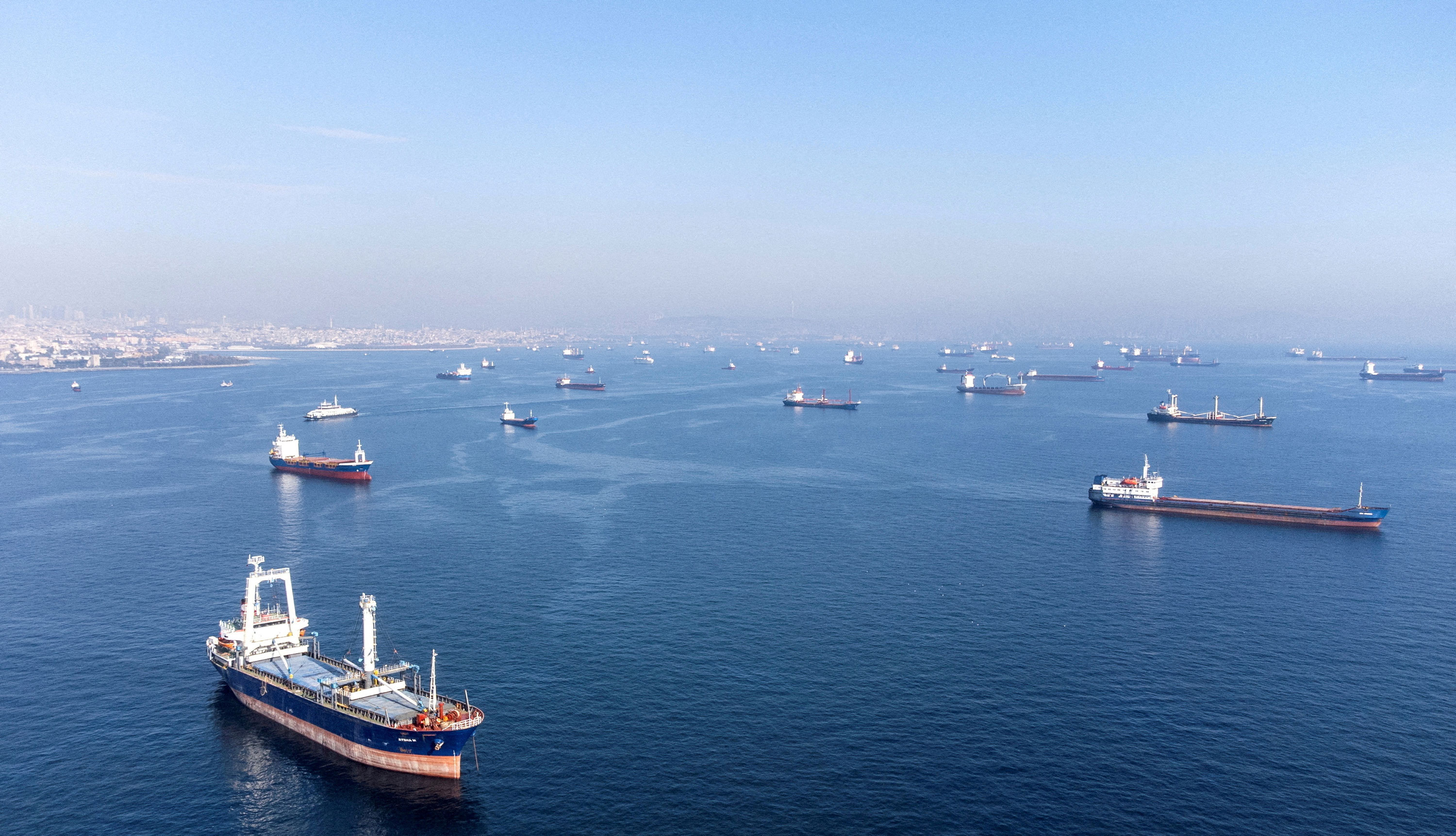 Commercial vessels, including vessels that are part of Black Sea grain deal, wait to pass the Bosphorus strait off the shores of Yenikapi in Istanbul on October 31, 2022. 