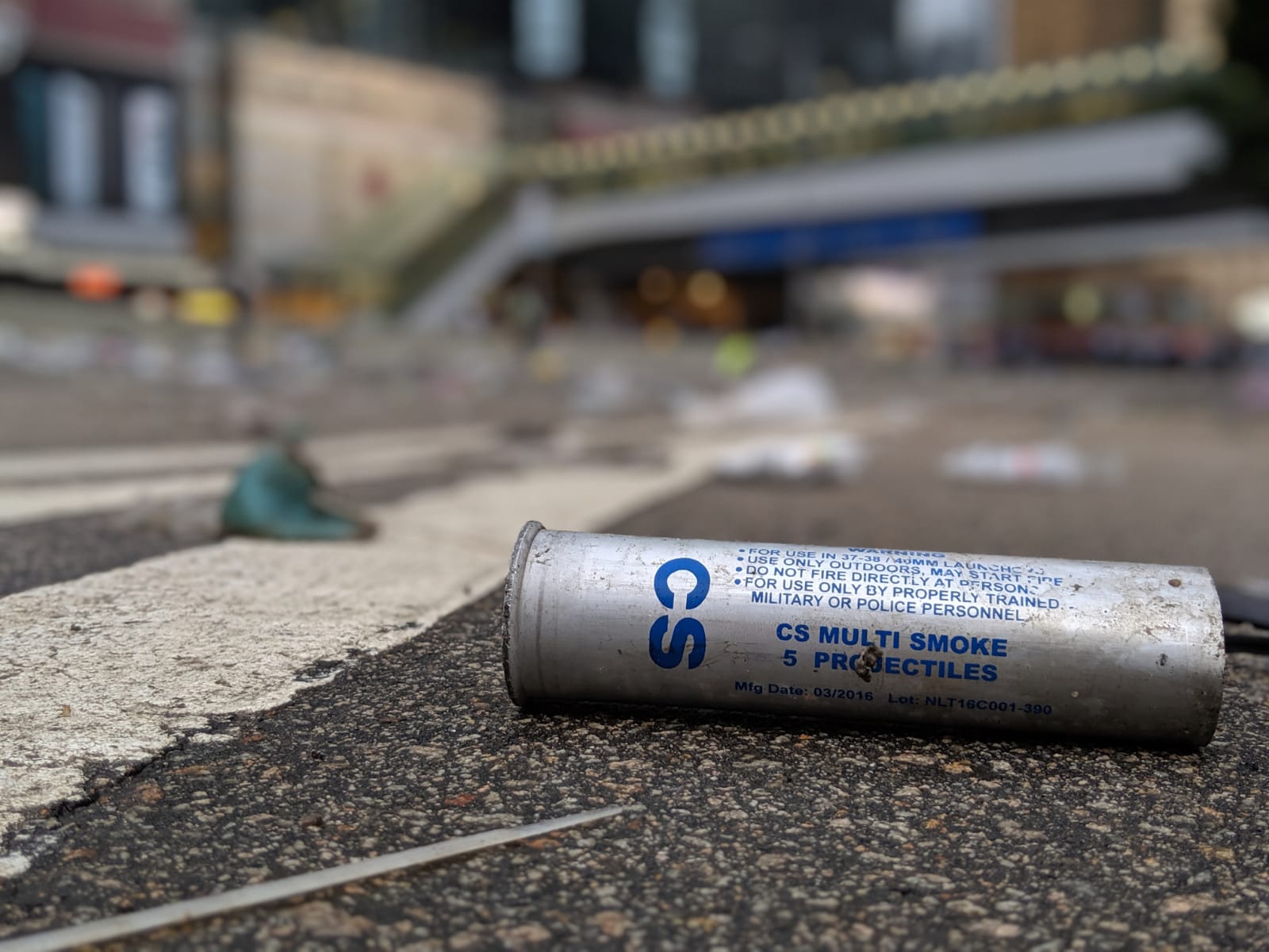 A used CS gas canister on the ground in Hong Kong.