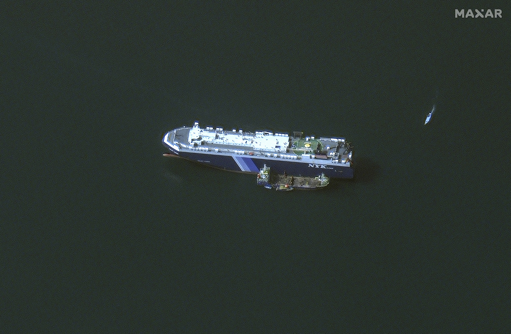 The Galaxy Leader ship anchored offshore of As Salif, Yemen, on November 28, with a support tender vessel positioned nearby. The ship was captured by Houthi fighters on November 19. 
