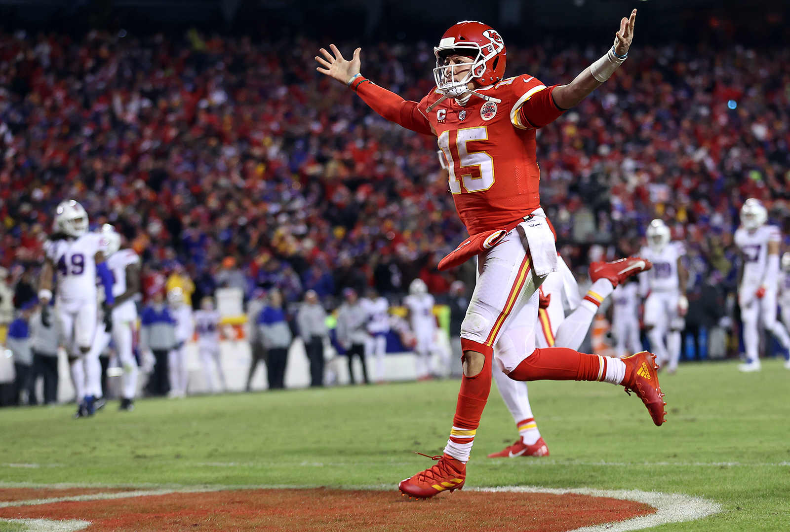 Patrick Mahomes runs toward the end zone while celebrating a touchdown scored by Tyreek Hill during the fourth quarter of the AFC Divisional Playoff game against the Buffalo Bills at Arrowhead Stadium on January 23, in Kansas City, Missouri.