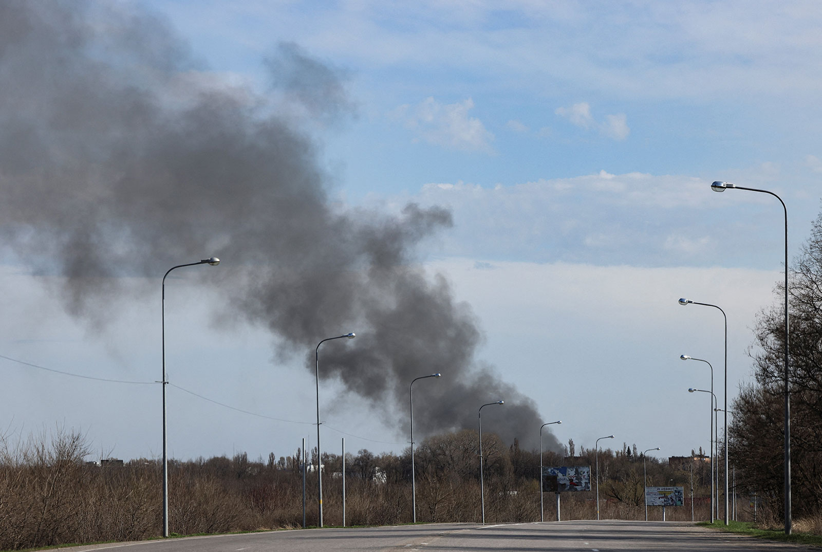 Smoke rises from the airport in Dnipro on Sunday, April 10. 