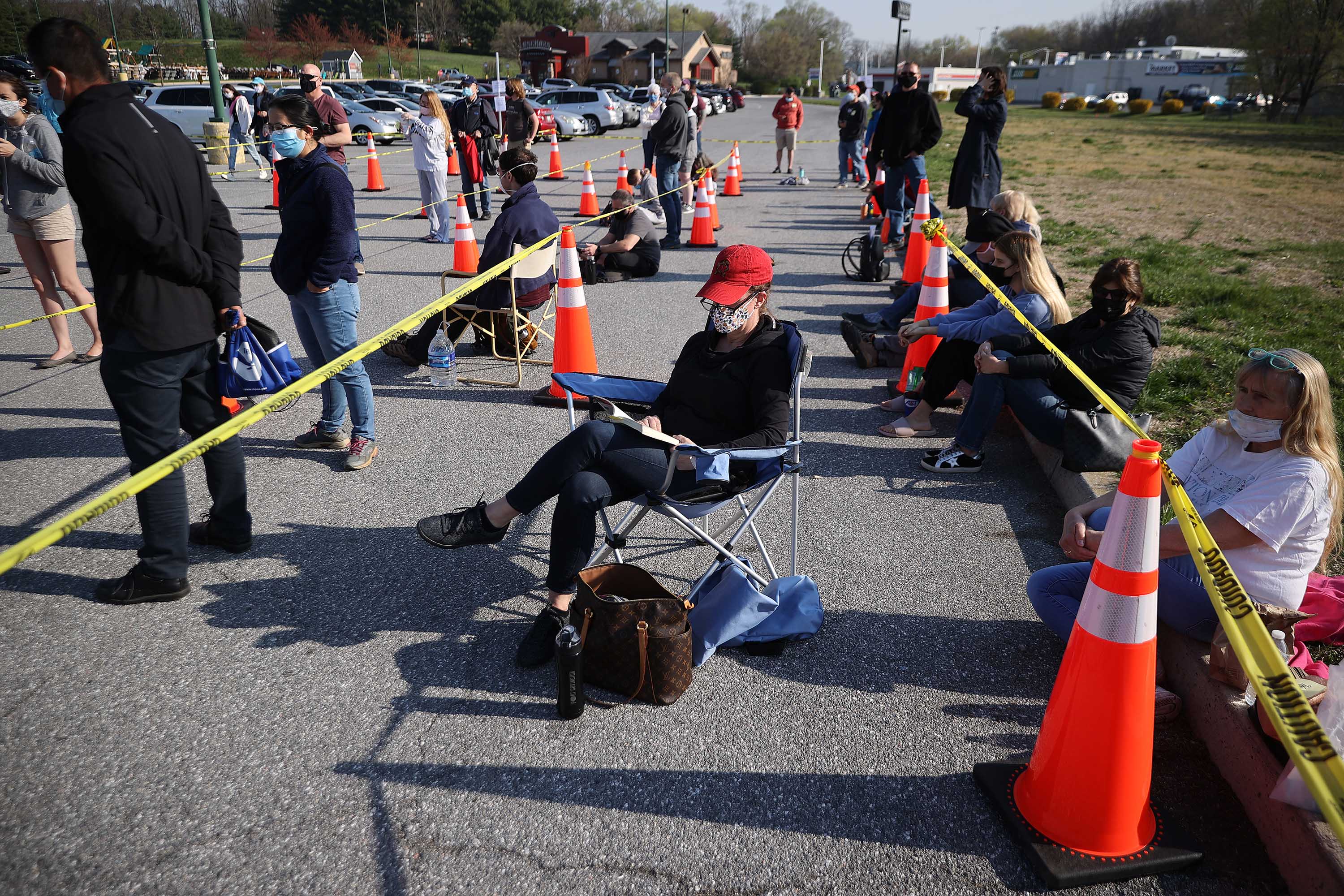 People wait outside a mass coronavirus vaccination site in Hagerstown, Maryland, on April 7. 