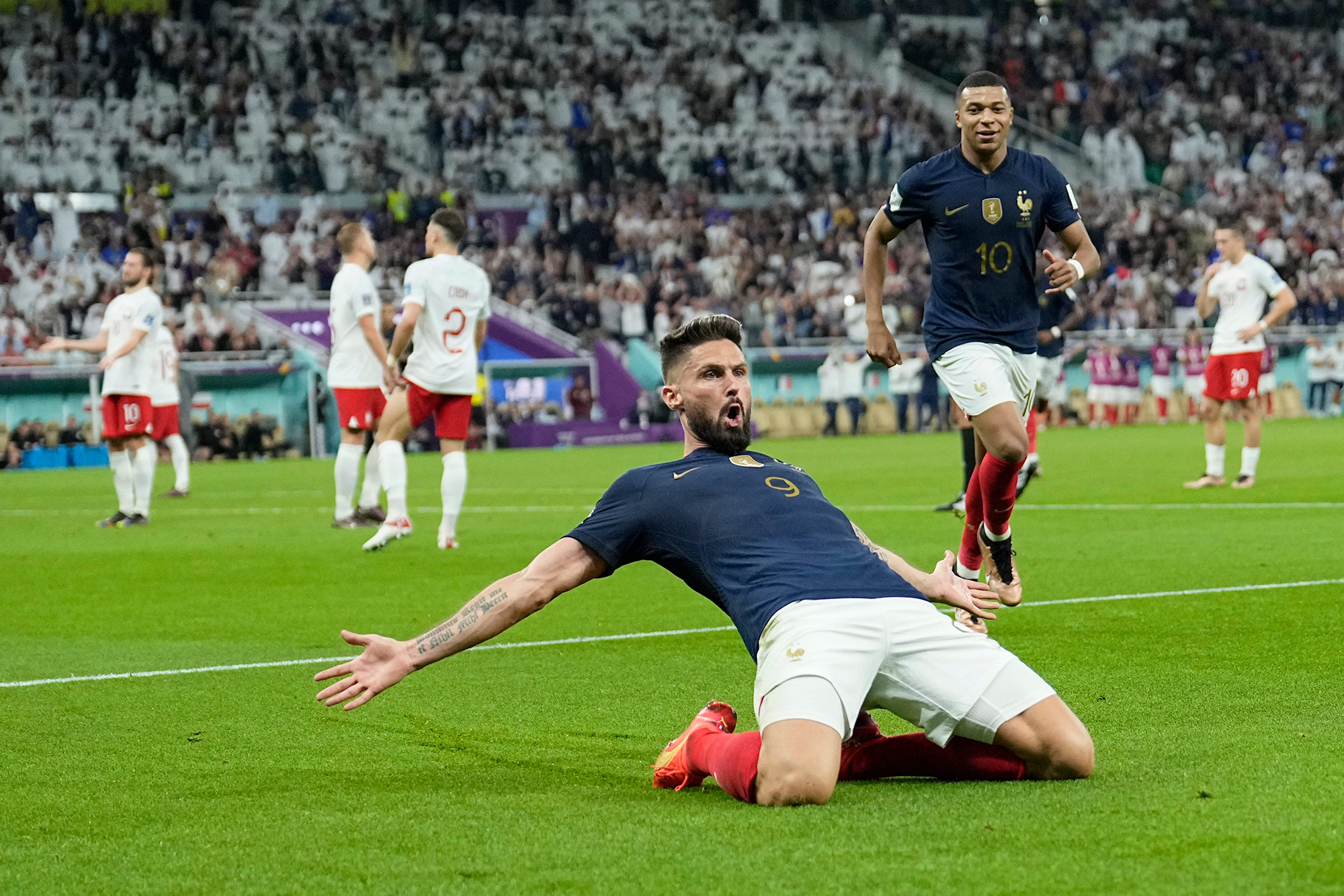 France's Olivier Giroud celebrates after scoring the opening goal against Poland on Sunday. 