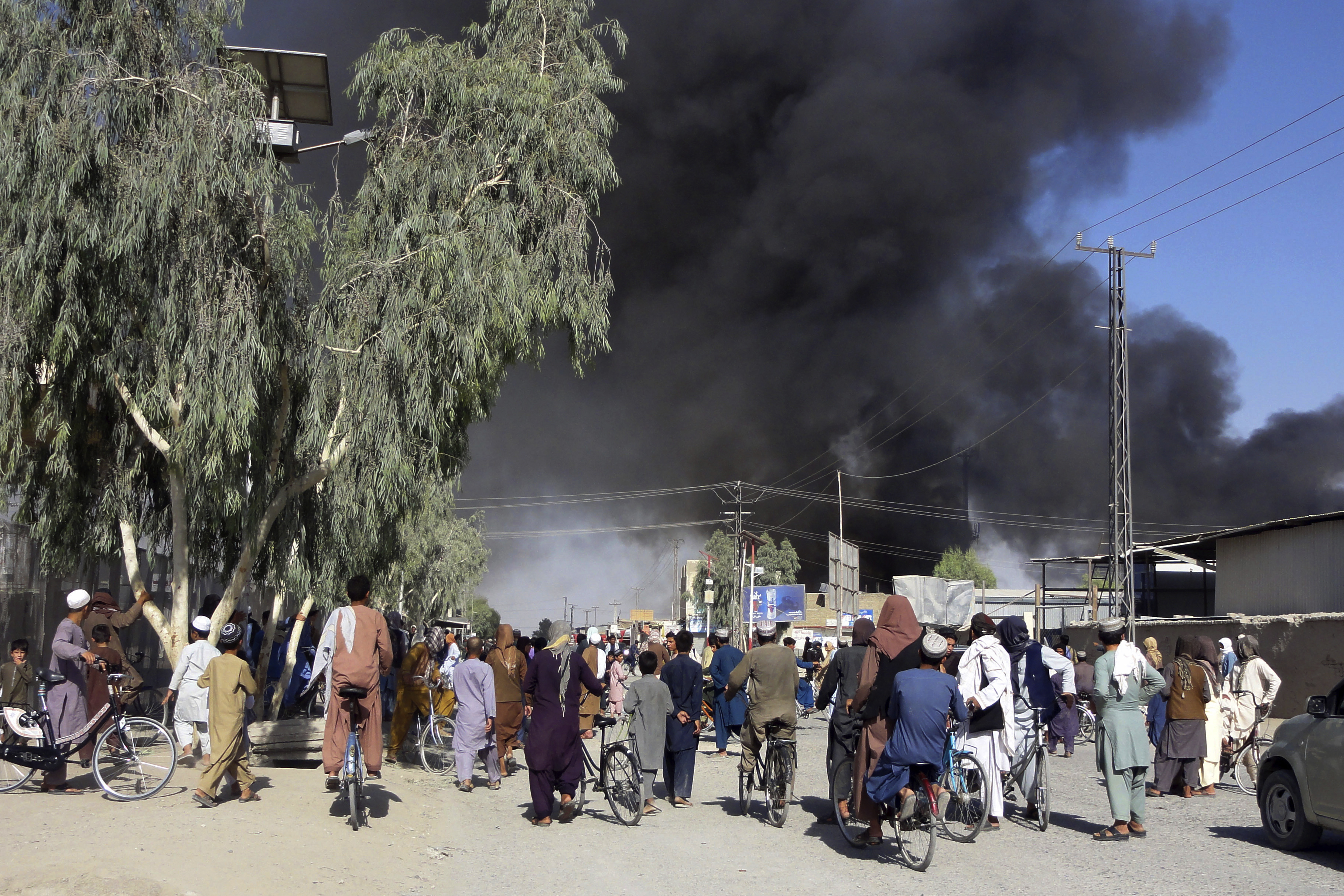 Smoke rises after fighting between the Taliban and Afghan security personnel, in Kandahar, Afghanistan, on Thursday, August 12, 2021.