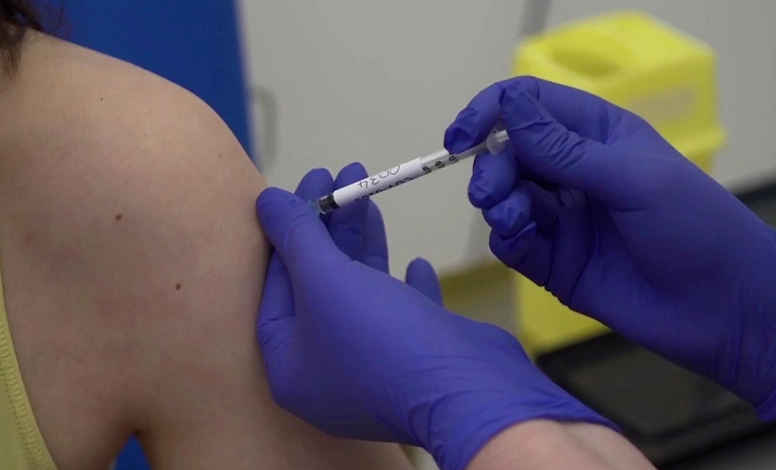 A screen grab taken from video issued by Britain's Oxford University, shows microbiologist Elisa Granato, being injected as part of the first human trials in the UK for a potential coronavirus vaccine, untaken by Oxford University, England, on Thursday, April 23.