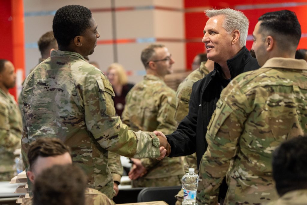 McCarthy meets with troops in Poland, in this handout photo released on April 10. 