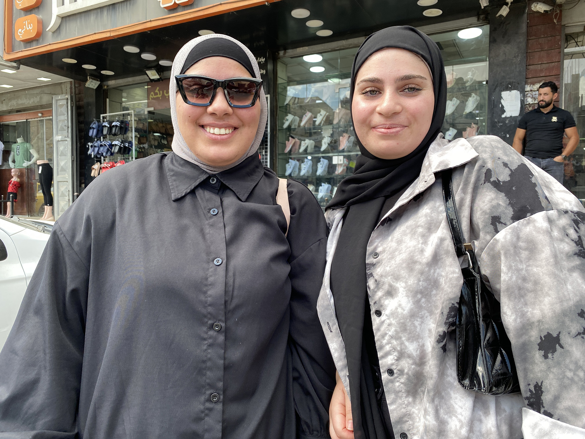 Noor Barakat, right, with her sister Shuroq Barakat outside a shop in Dheisheh.