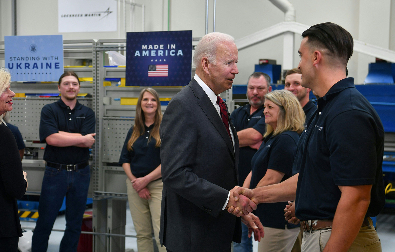 President Biden shakes hands with an employee at Lockheed Martin’s manufacturing facility in Troy, Alabama, on Tuesday.