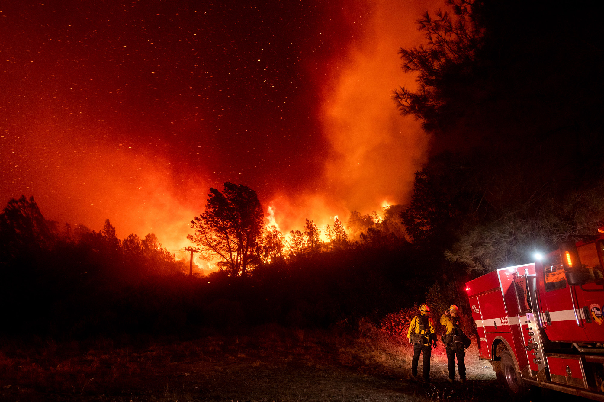 Firefighters watch the Bear Fire approach in Oroville, California, on September 9.