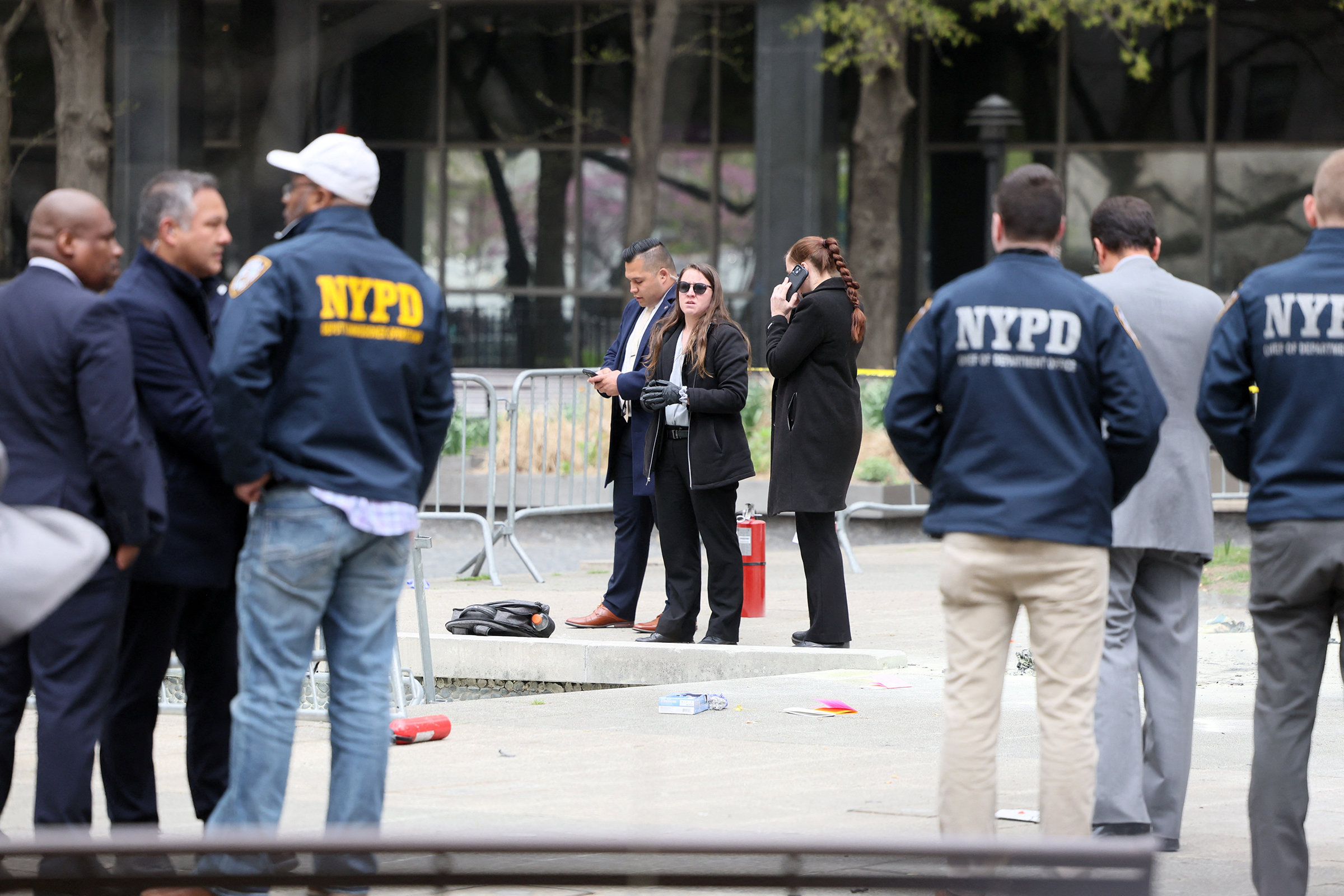 Emergency personnel respond to a report of a person covered in flames outside the courthouse where former US President Donald Trump's criminal hush money trial is underway, in New York, on April 19.