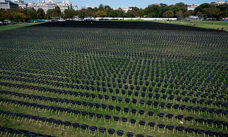 Empty chairs are on display to represent the 200,000 lives lost due to COVID-19 at the National Covid-19 Remembrance, on the ellipse behind the White House in Washington, DC on October 4, 2020. 