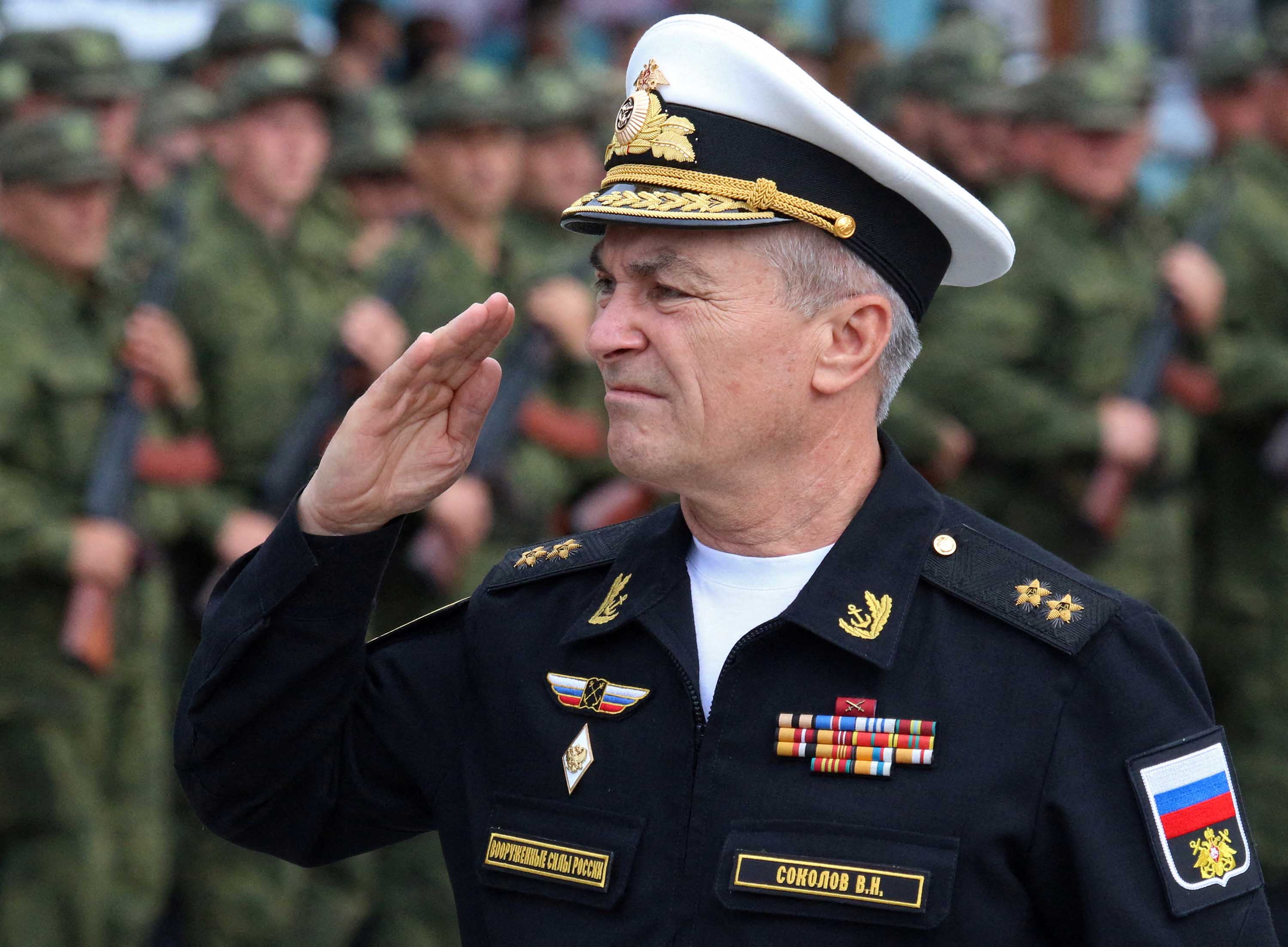 Commander of the Russian Black Sea Fleet Vice-Admiral Viktor Sokolov salutes during a send-off ceremony for reservists, in Sevastopol, Crimea, in September 2022.