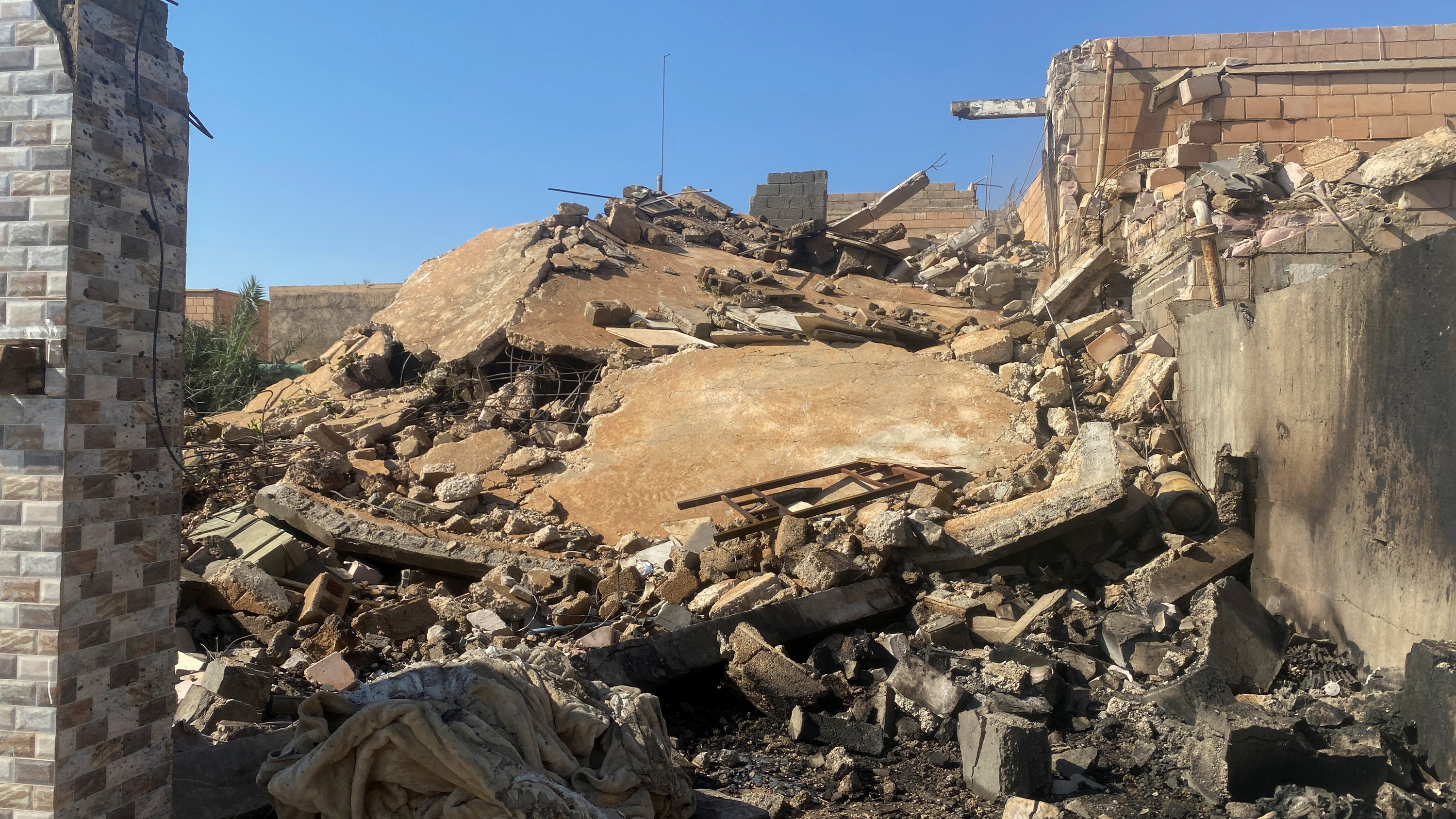 A destroyed building at the site of a US airstrike in Al Qaim, Iraq, February 3, 2024.