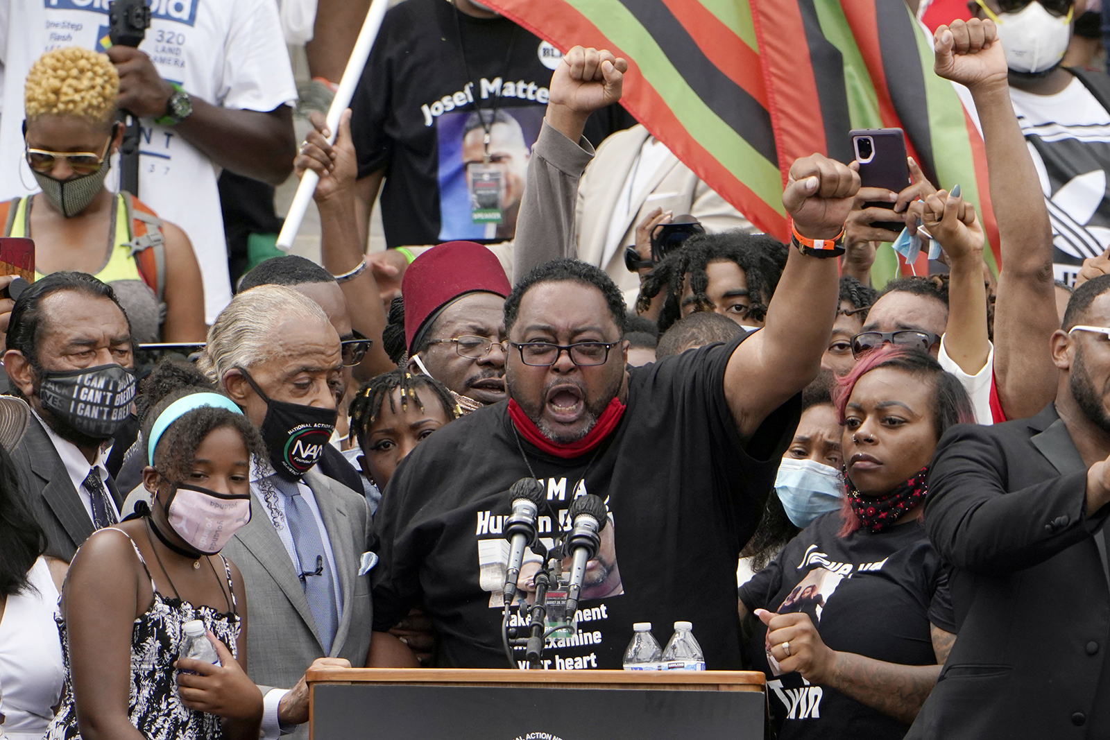 Jacob Blake Sr., father of Jacob Blake, raises his fist in the air while speaking at the March on Washington, on Friday August 28, at the Lincoln Memorial in Washington.