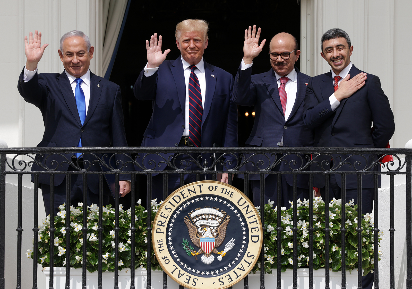 (Left to Right) Prime Minister of Israel Benjamin Netanyahu, US President Donald Trump, Foreign Affairs Minister of Bahrain Abdullatif bin Rashid Al Zayani, and Foreign Affairs Minister of the United Arab Emirates Abdullah bin Zayed bin Sultan Al Nahyan wave from the Truman Balcony of the White House on September 15 .