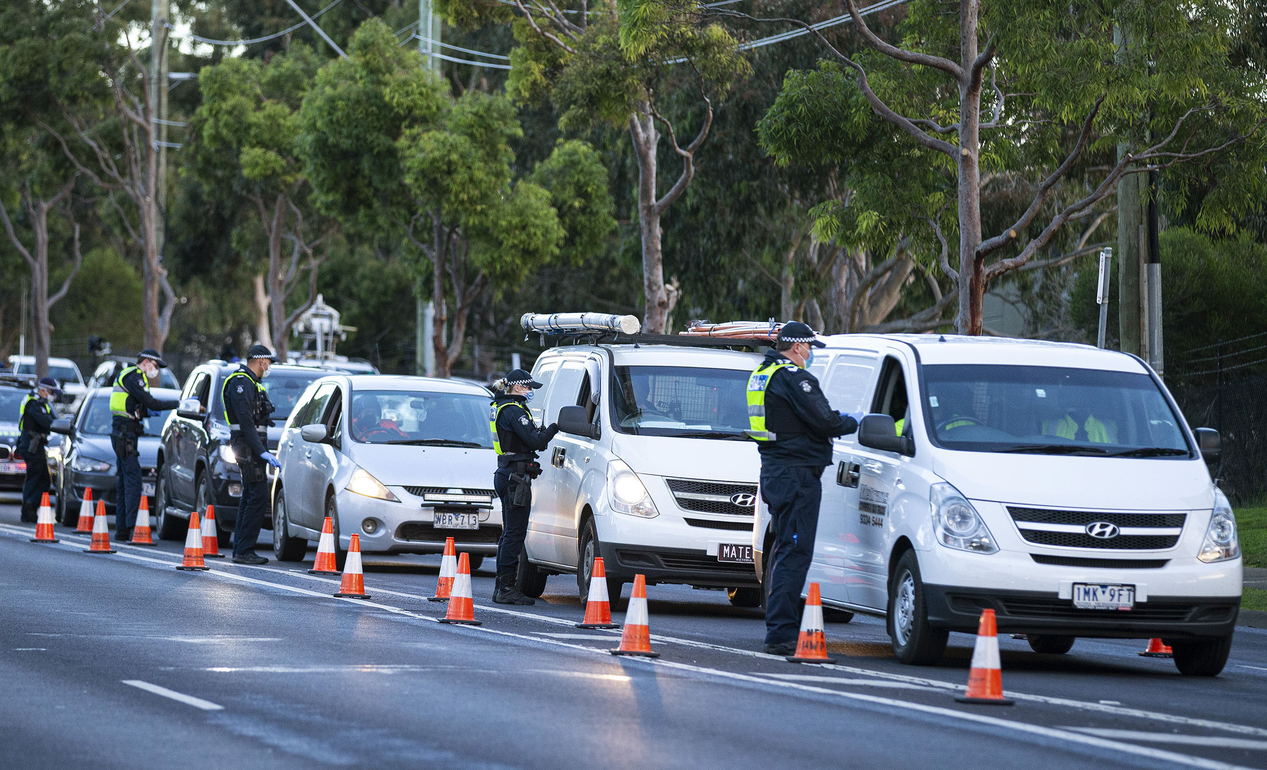 Police check drivers at a roadblock in Melbourne, Australia, on Thursday, on July 2. 