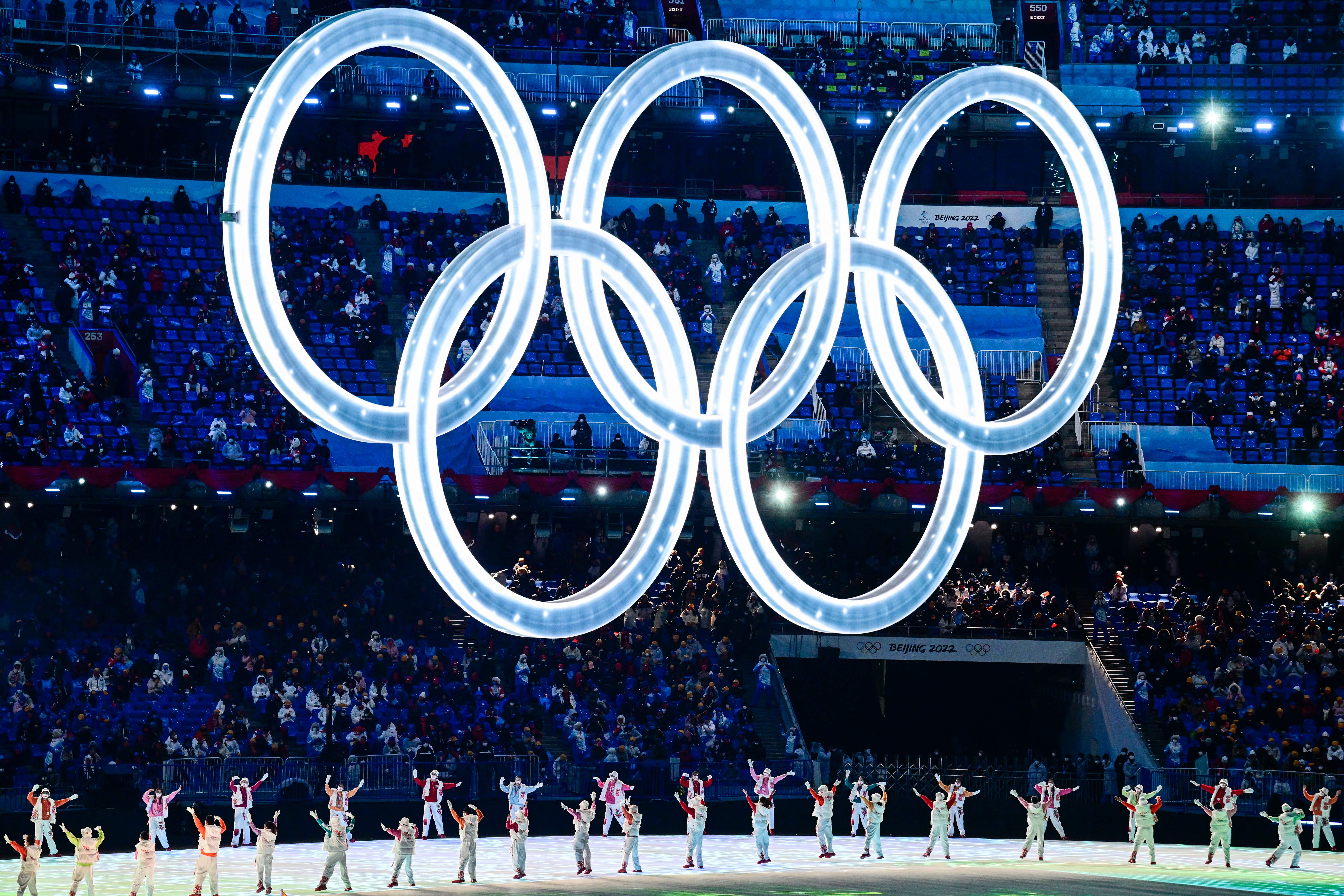 Performers dance under the Olympic Rings during the opening ceremony of the Beijing 2022 Winter Olympic Games, at the National Stadium in Beijing, on February 4.
