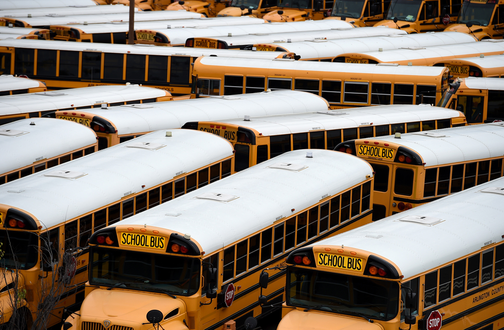School buses are parked at the Arlington County Bus Depot on March 31, in Arlington, Virginia.
