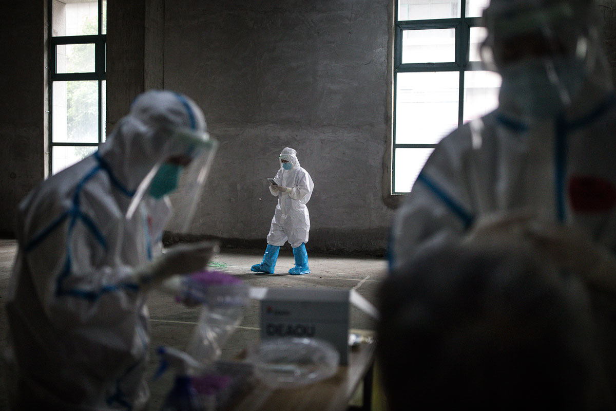 Medical workers at a coronavirus testing site on May 15 in Wuhan, China.