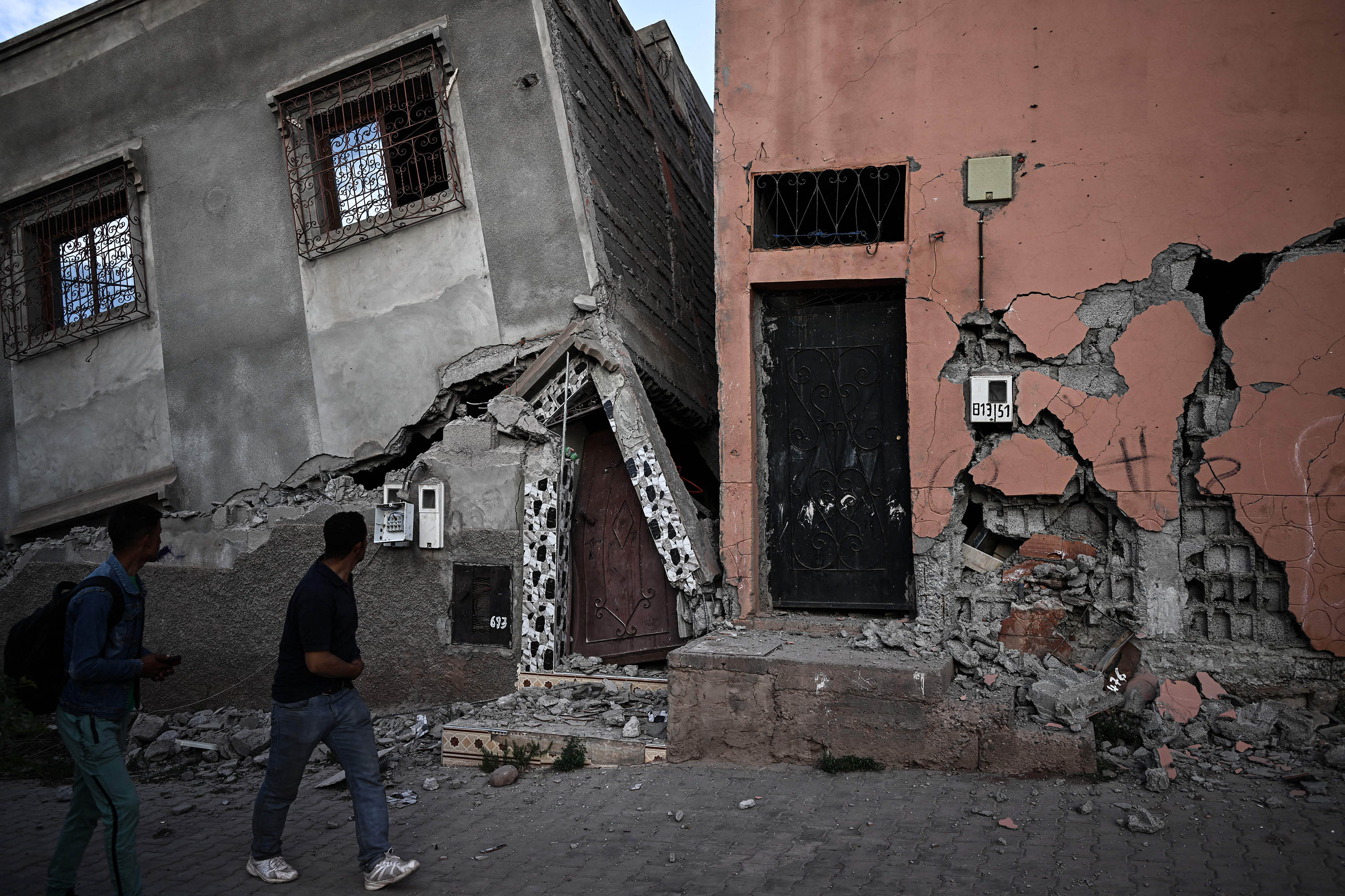 A resident walks past damaged houses in the aftermath of the earthquake in Moulay Brahim, Morocco, on Sunday, September 10. 