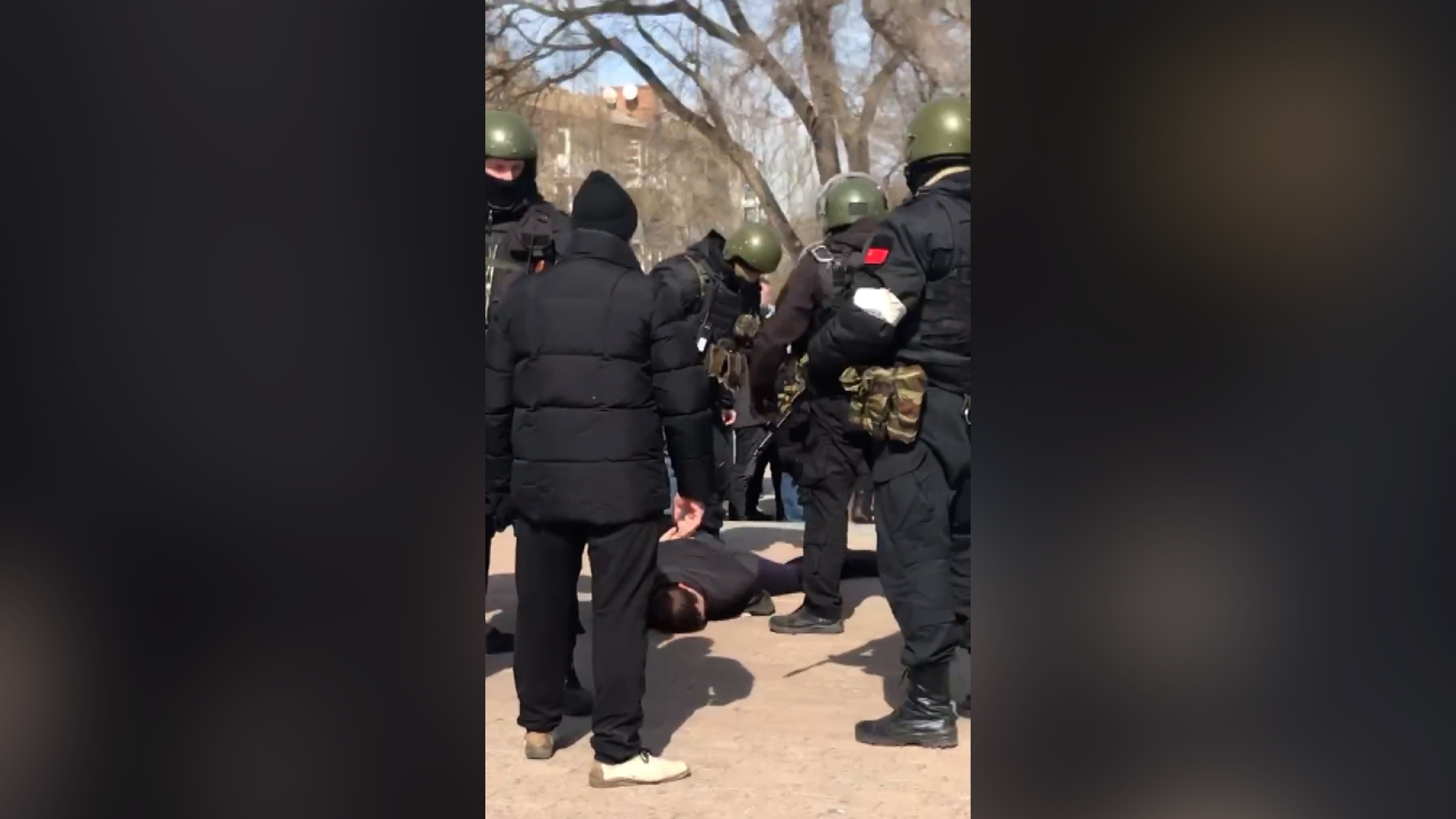 Russian military troops appeared to detain at least two Ukrainian protesters, and kick at least one in Berdyansk, Ukraine on March 20.