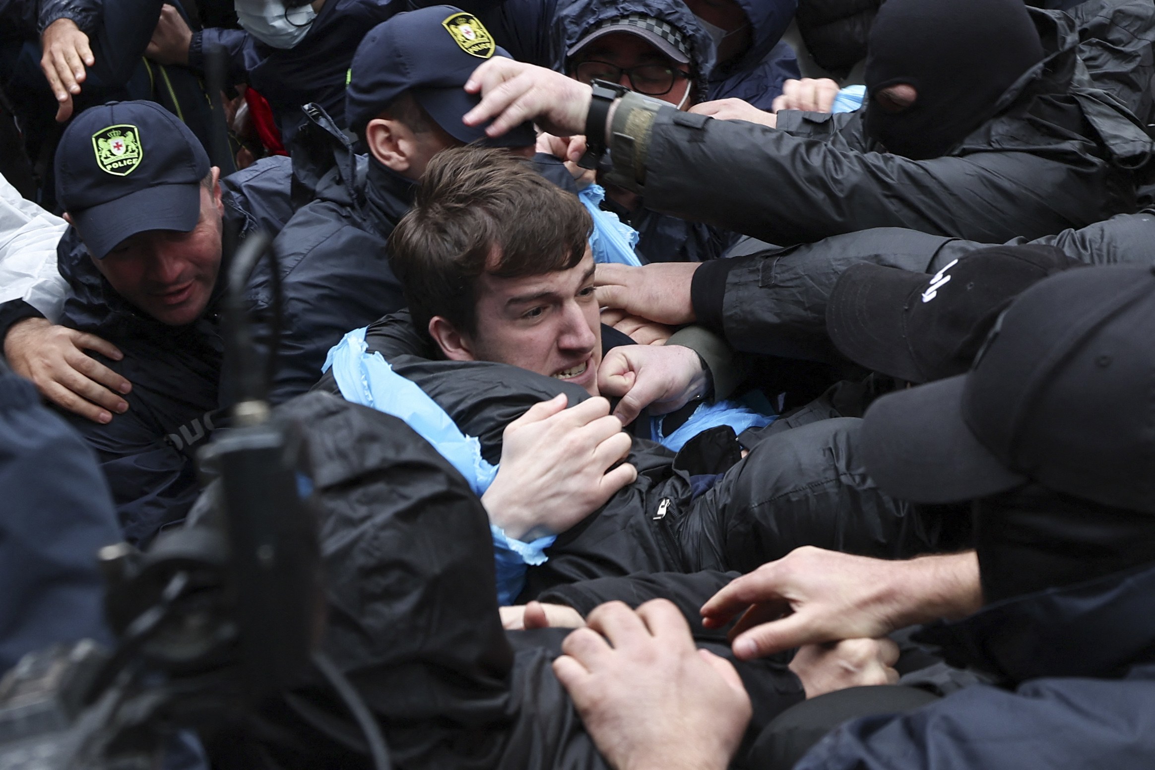 Georgian law enforcement officers detain a demonstrator in Tbilisi on May 14.