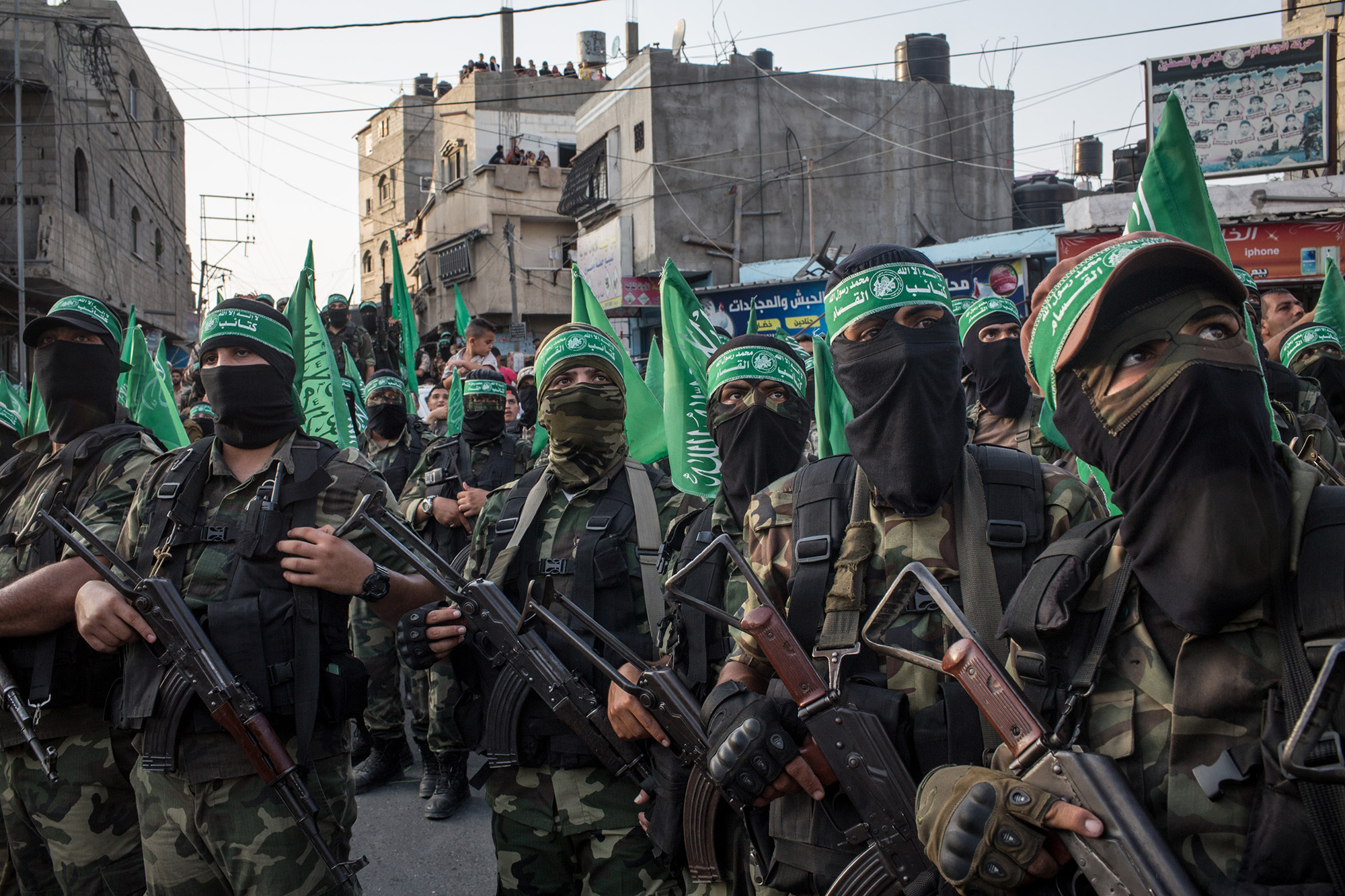 Palestinian Hamas militants are seen during a military show in the Bani Suheila district on July 20, 2017, in Gaza City, Gaza. 